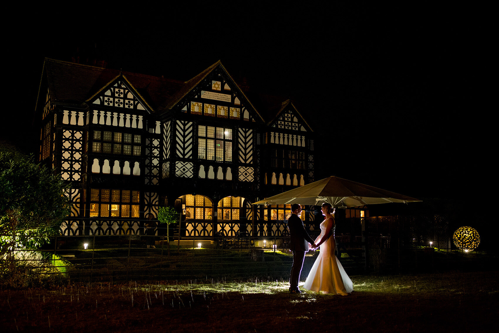 Bride and groom in front of a wedding venue