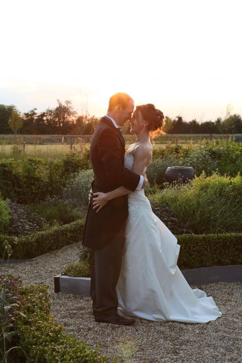 Sunset wedding photograph with the stunning bride and groom and South Farm wedding venue