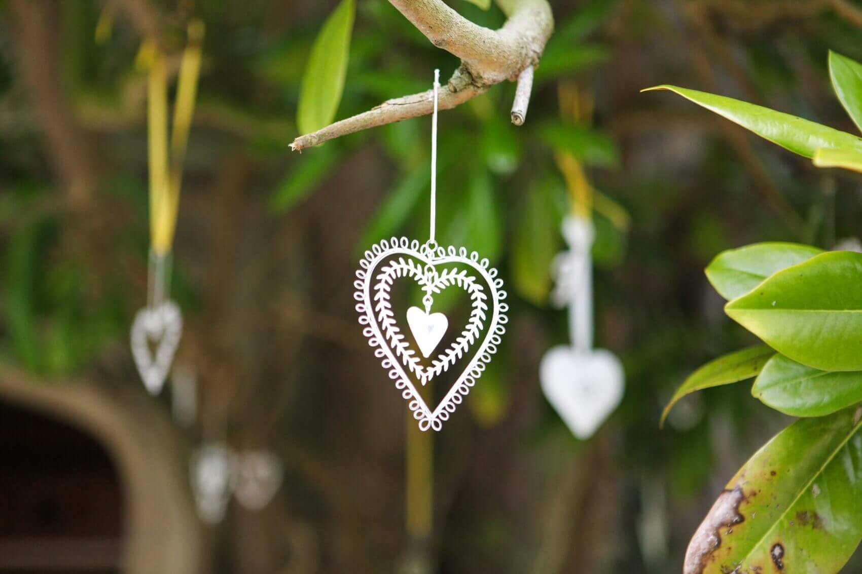 Delicate wedding decoration hanging from a tree at Tofte Manor Sharnbrook