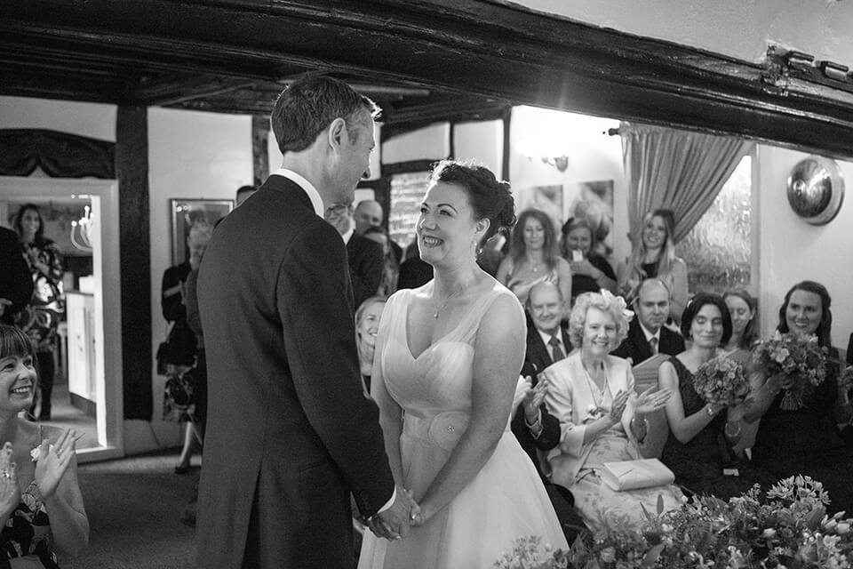 A happy bride smiling at her new husband