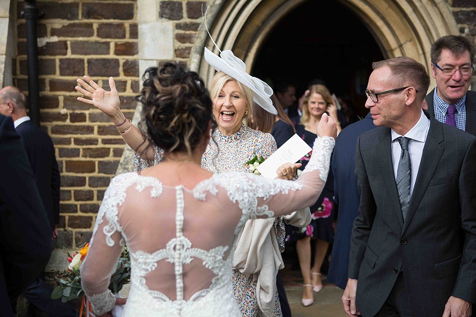 Mother and Bride smiling at each just before embracing