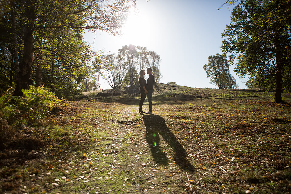 engagement shoot photo of a couple embracing in the countryside