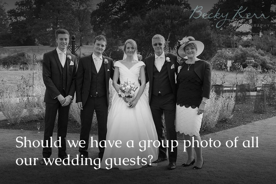 Should we have a group photo of all our wedding guests?