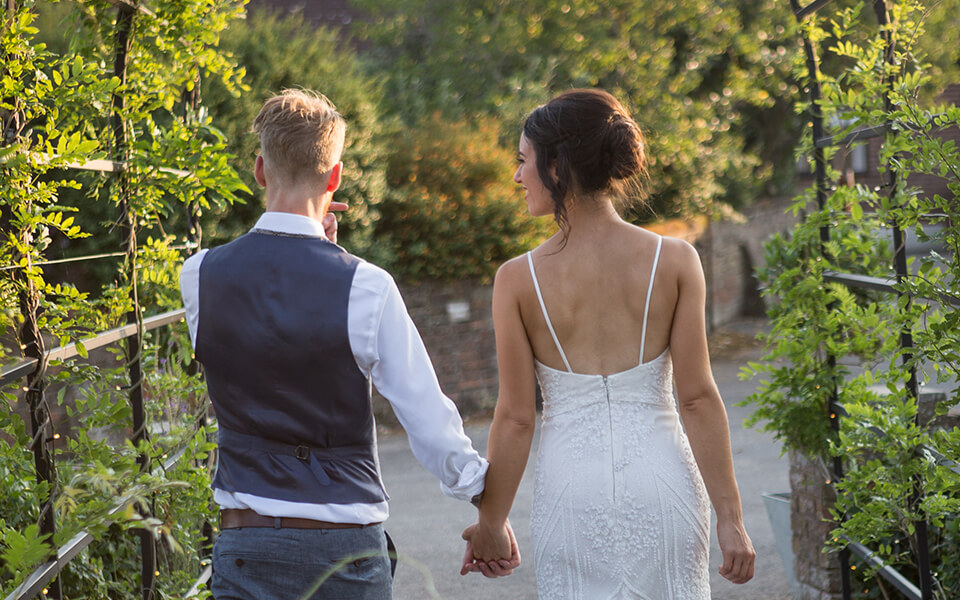 Bride and groom walking away