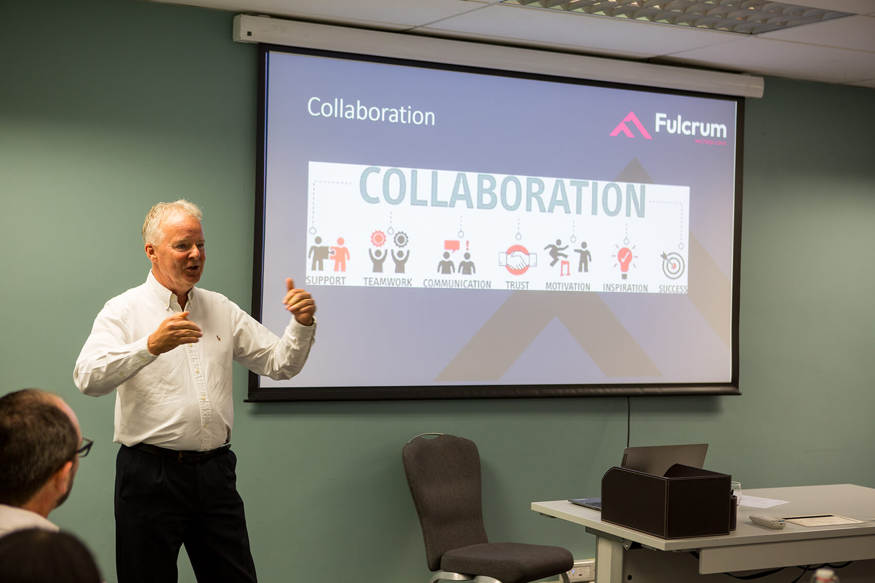 A man giving a presentation about collaboration