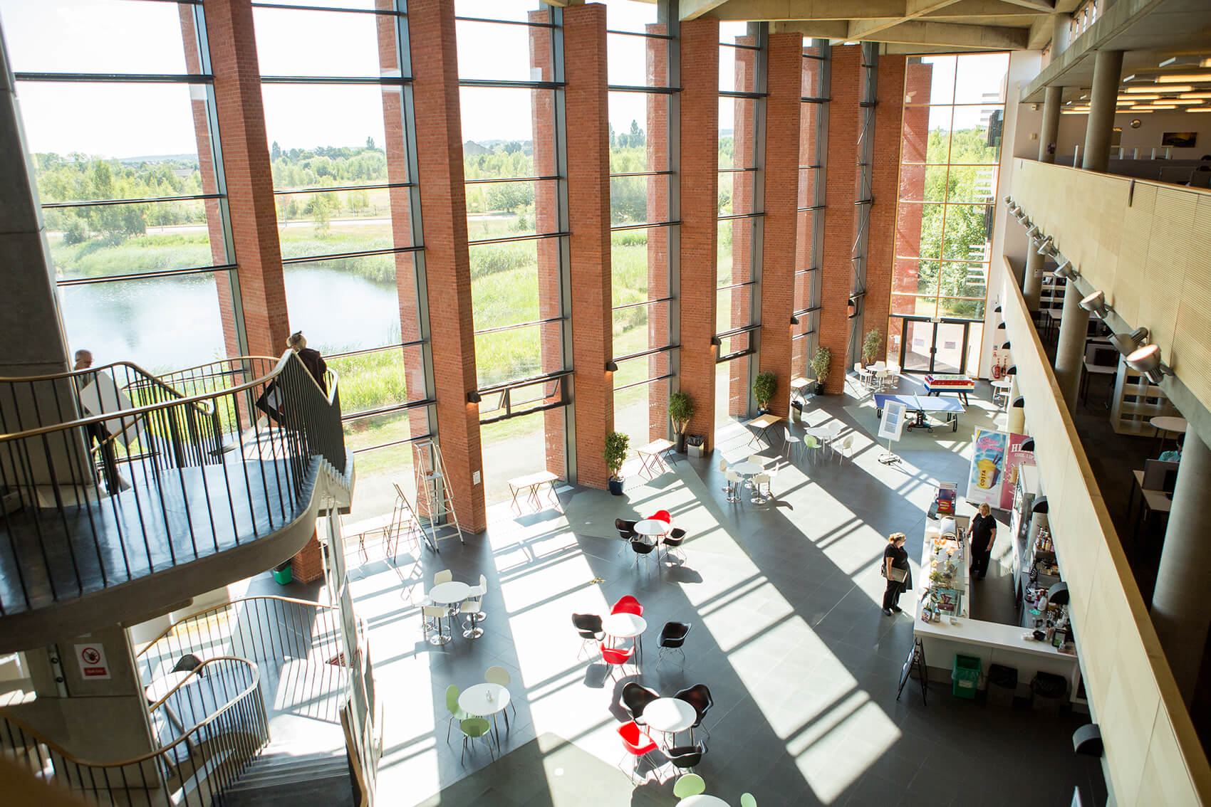 Image from above looking over tables and chairs in a school