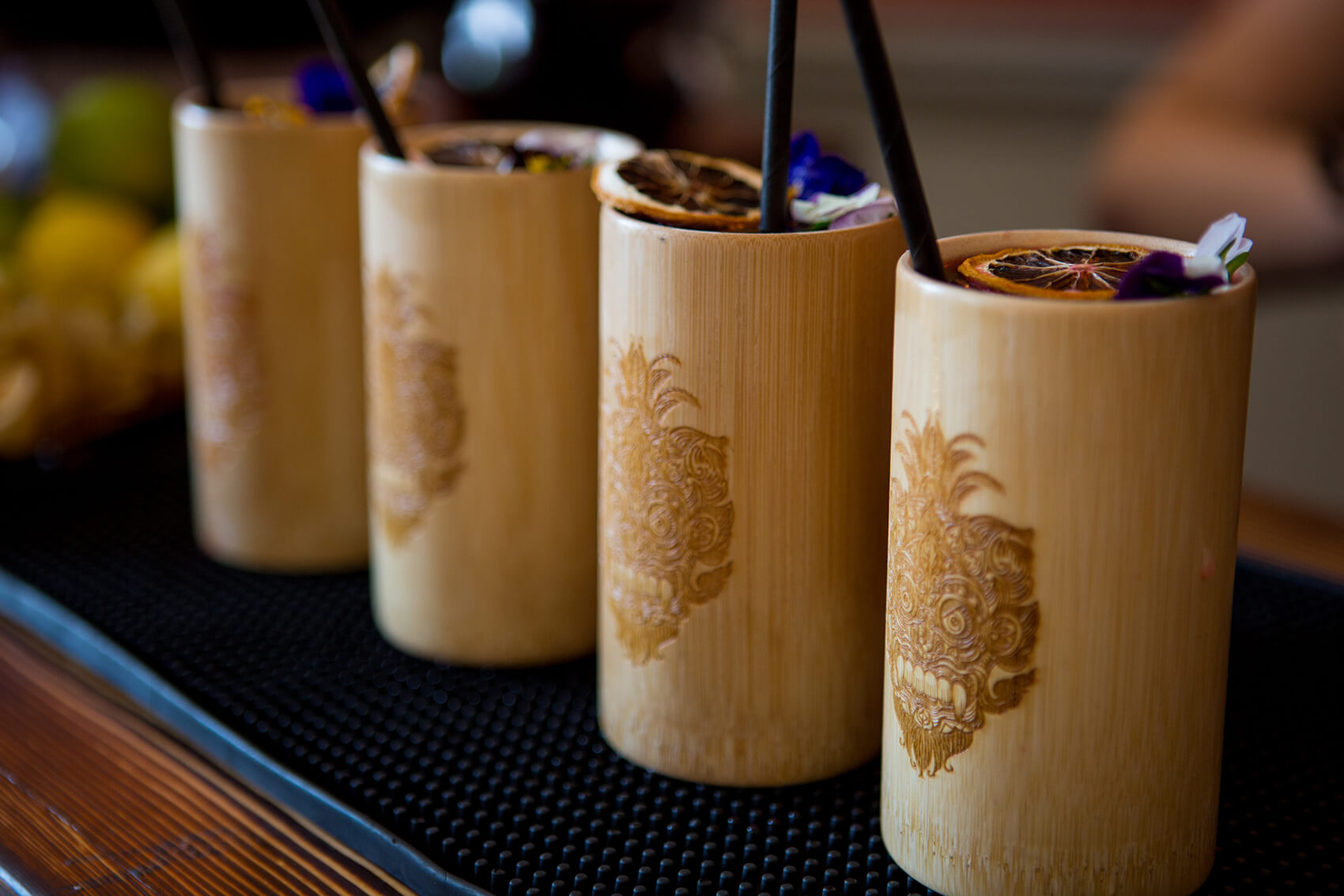 Four drinks in a row in bamboo cups