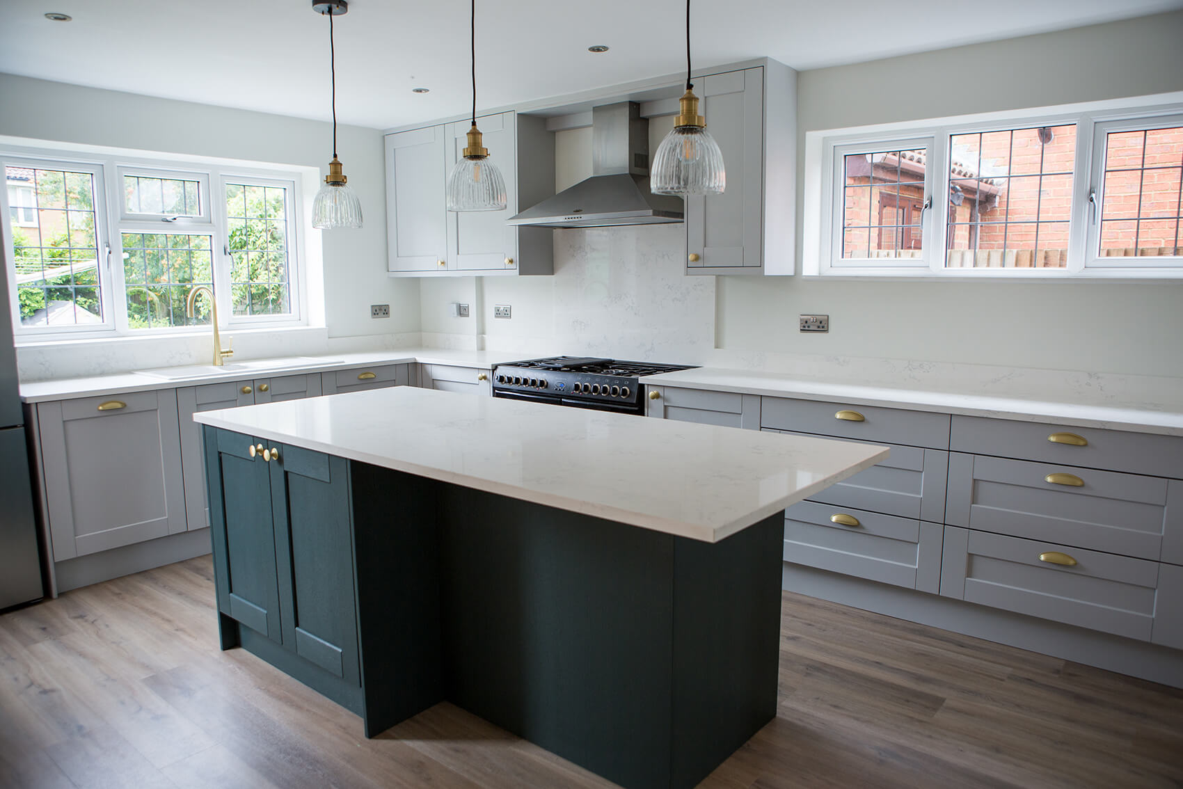 A kitchen with a large island in the middle