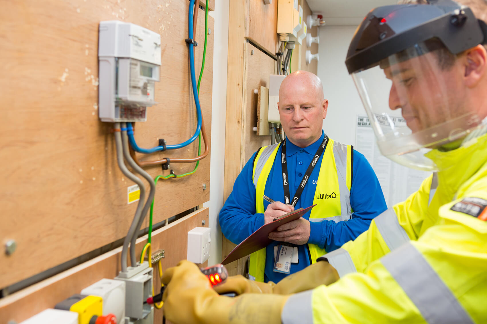 Two men working in high-vis jackets