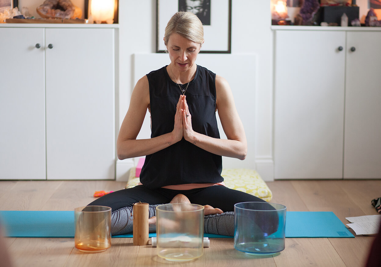 Woman meditating on a yoga mat