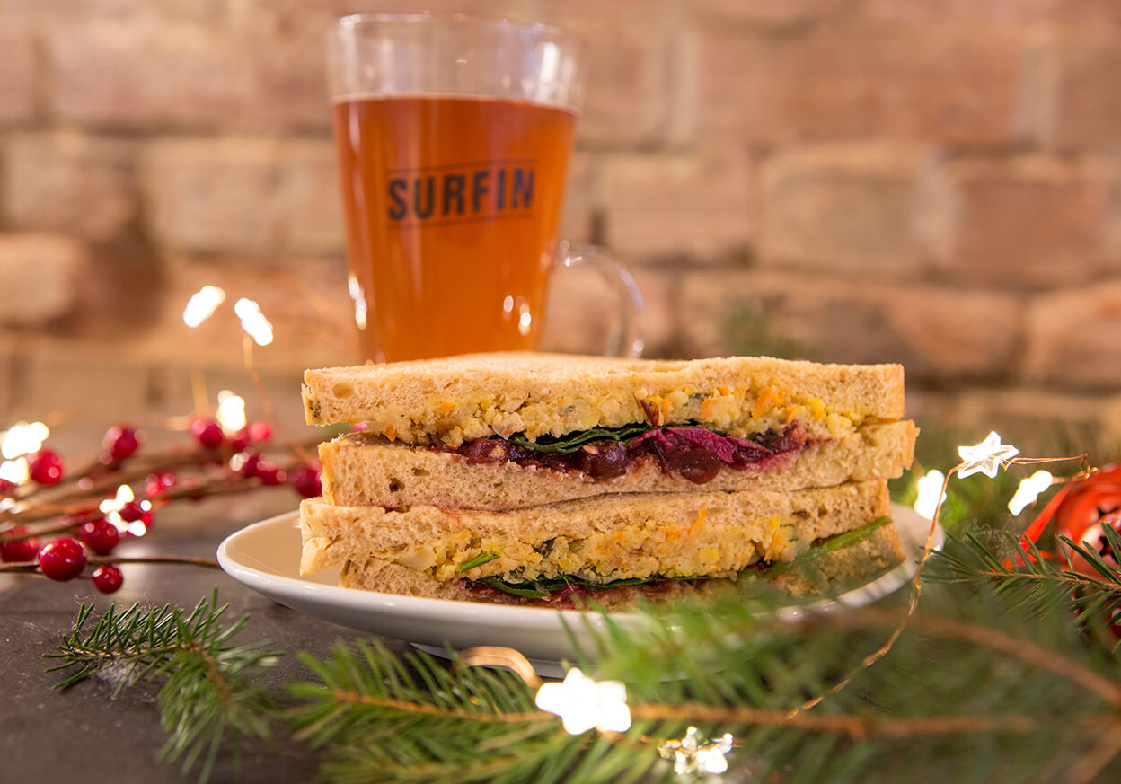 Sandwich and drink on a slate table