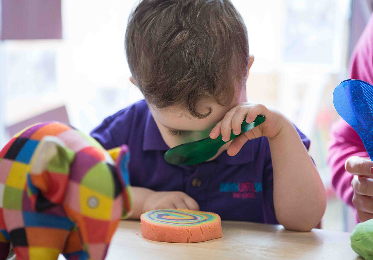 Child playing with a spoon