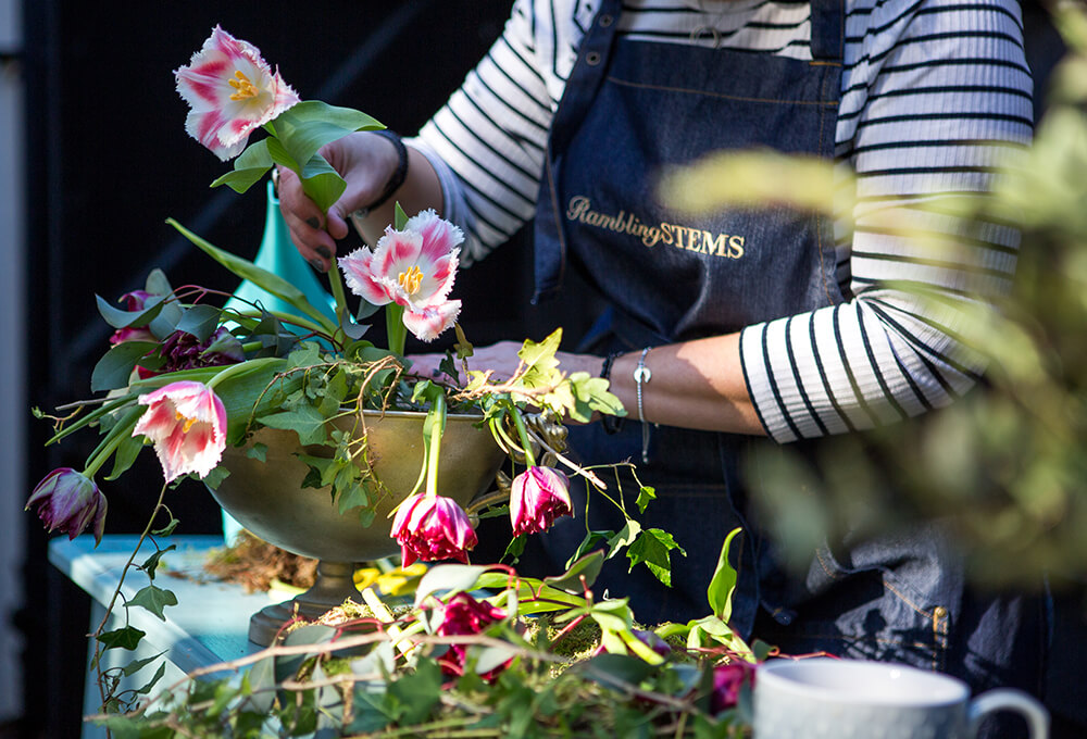 A woman arranging flowers