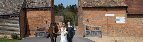Couple walking with a horse