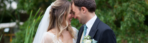 Happy newlyweds smiling at each other