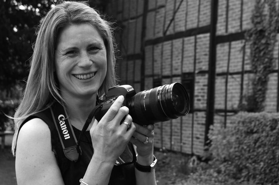 Becky Kerr smiling holding camera