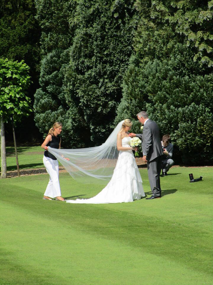 Becky kerr helping fix a vail for a bride