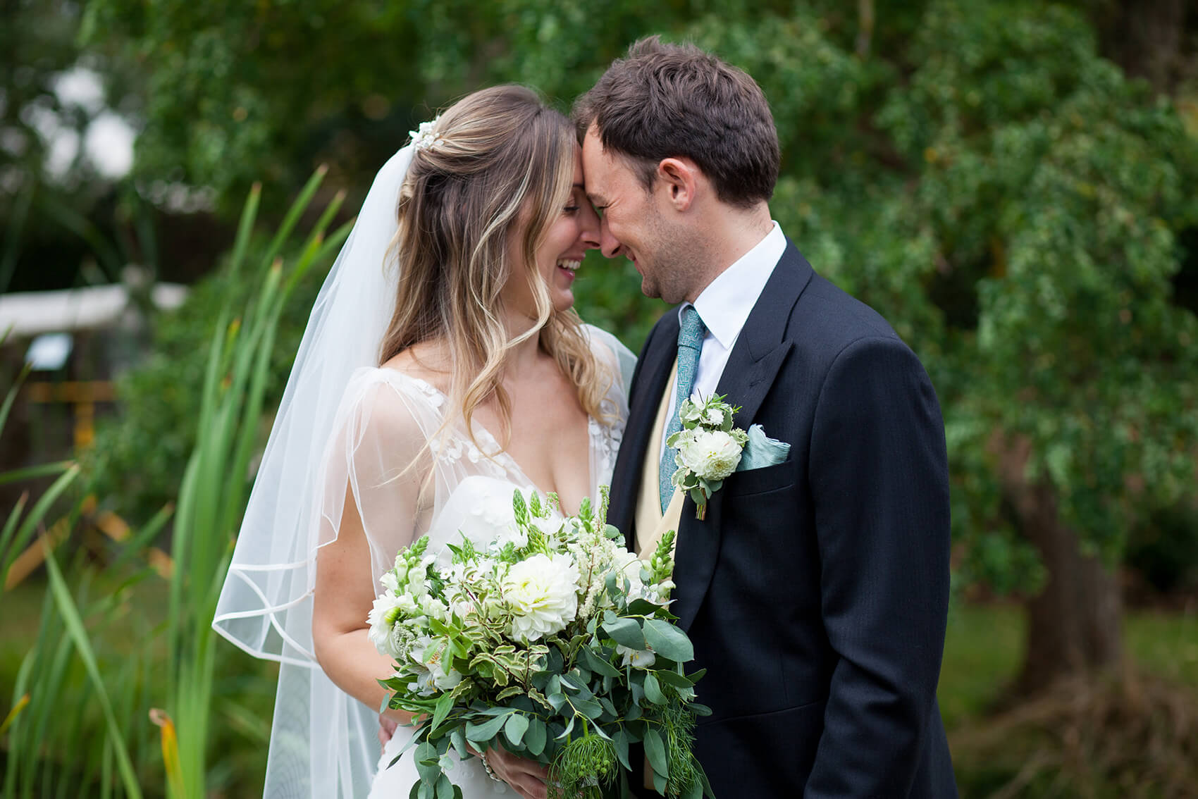 Newly weds smiling at each other