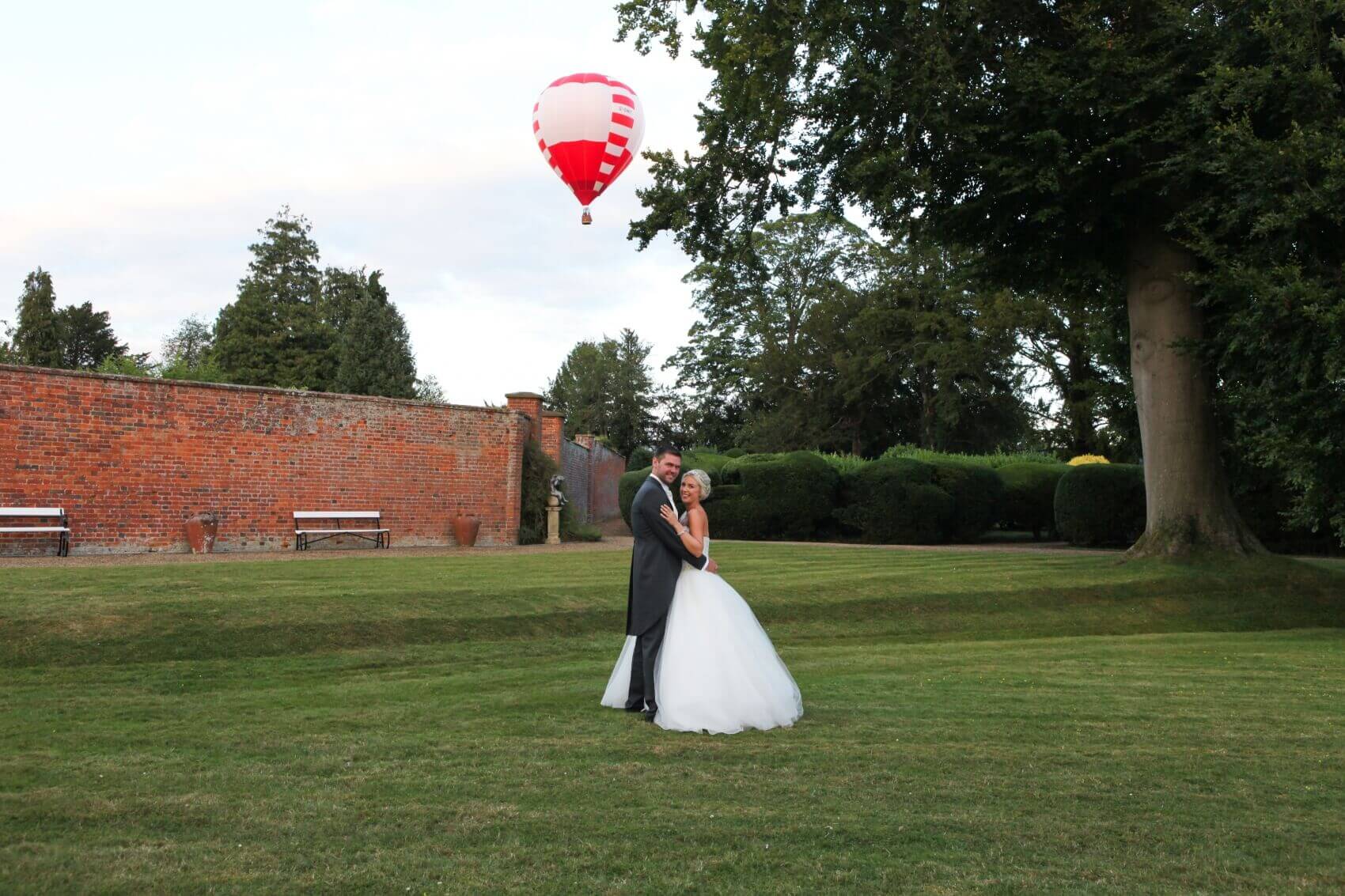 Bride and groom with a hot air ballon at Turvey House Bedfordshire 