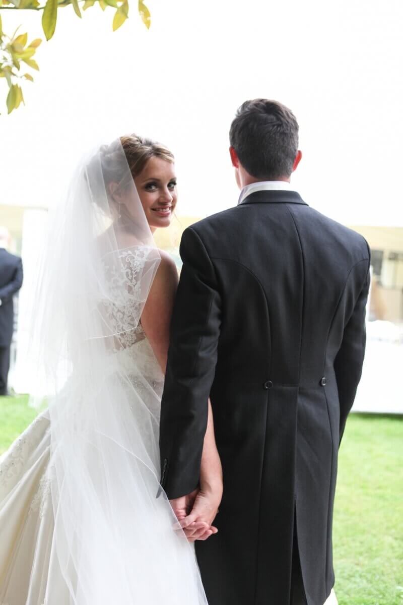 Bride looking at the camera at a summer Tofte Manor Sharnbrook wedding.